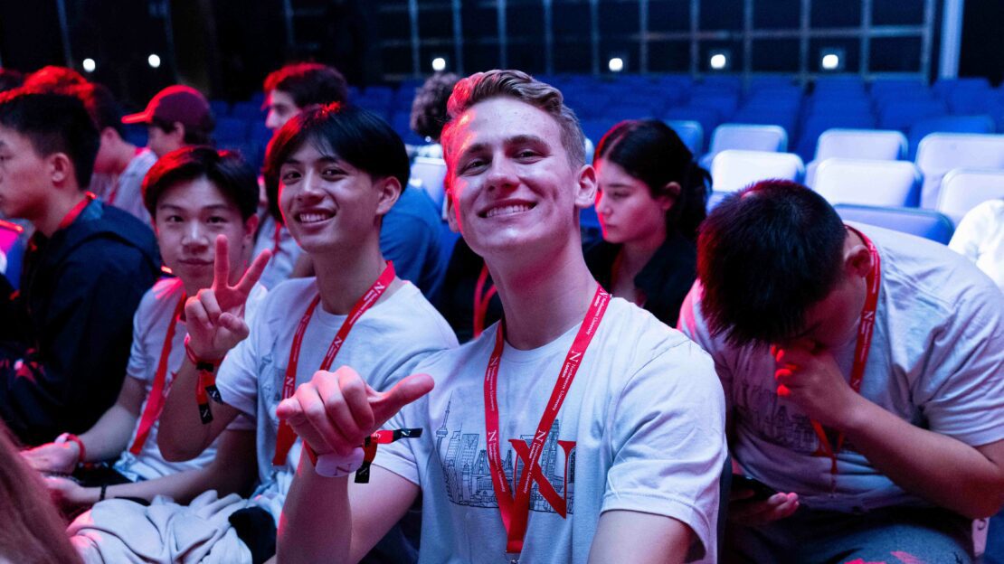 Students in an auditorium during a convocation ceremony at Northeastern University London