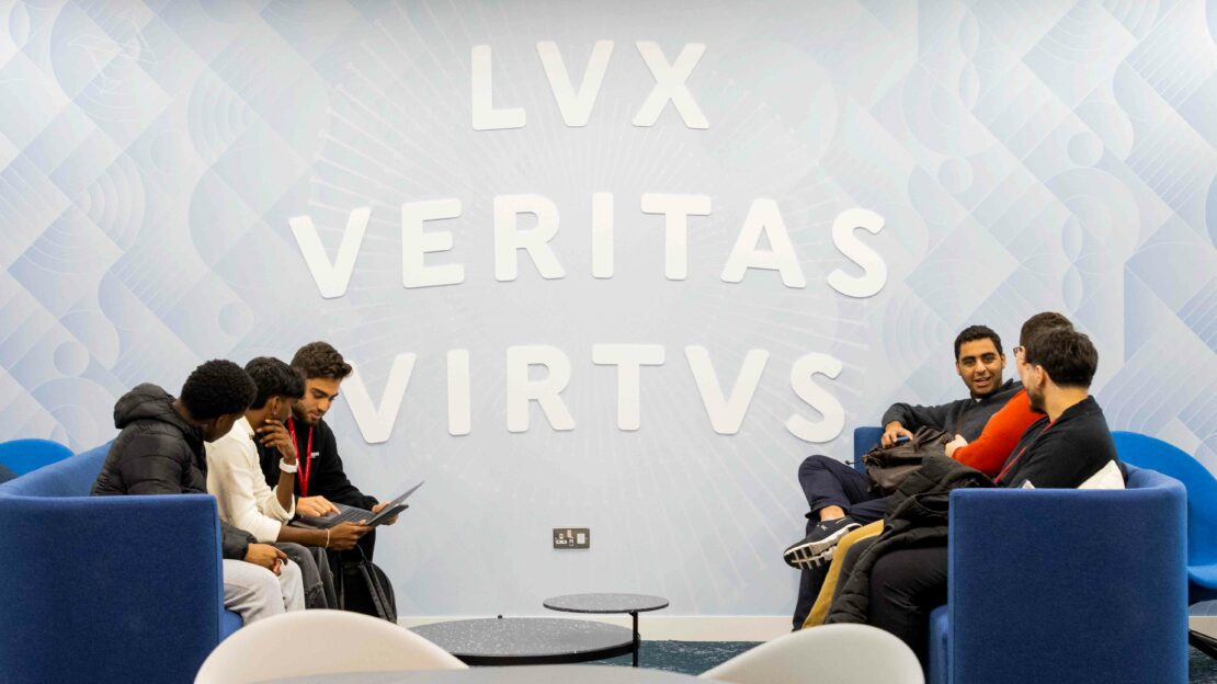 A group of students inside Northeastern University London's campus building